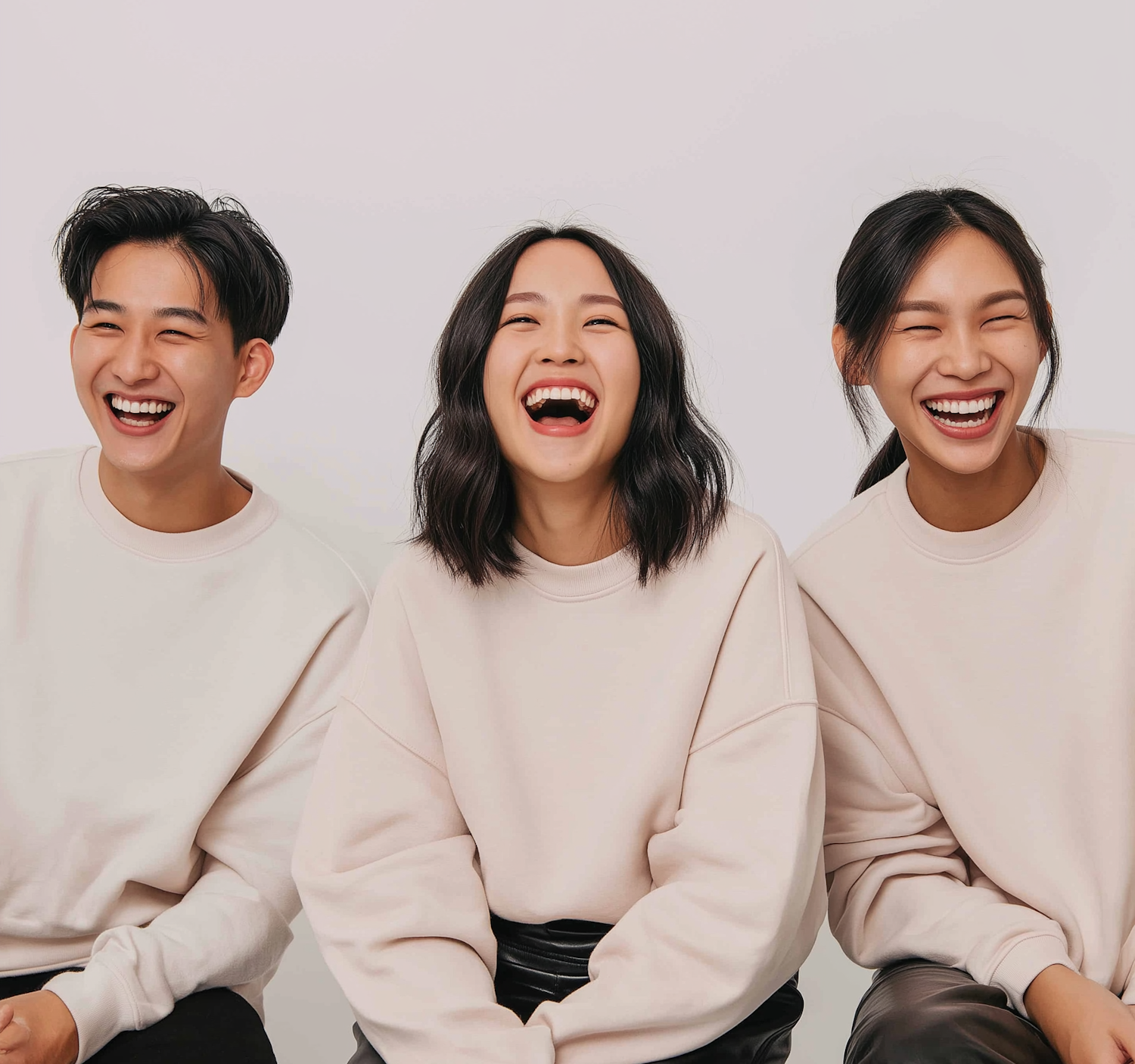 Friends laughing at something on a phone